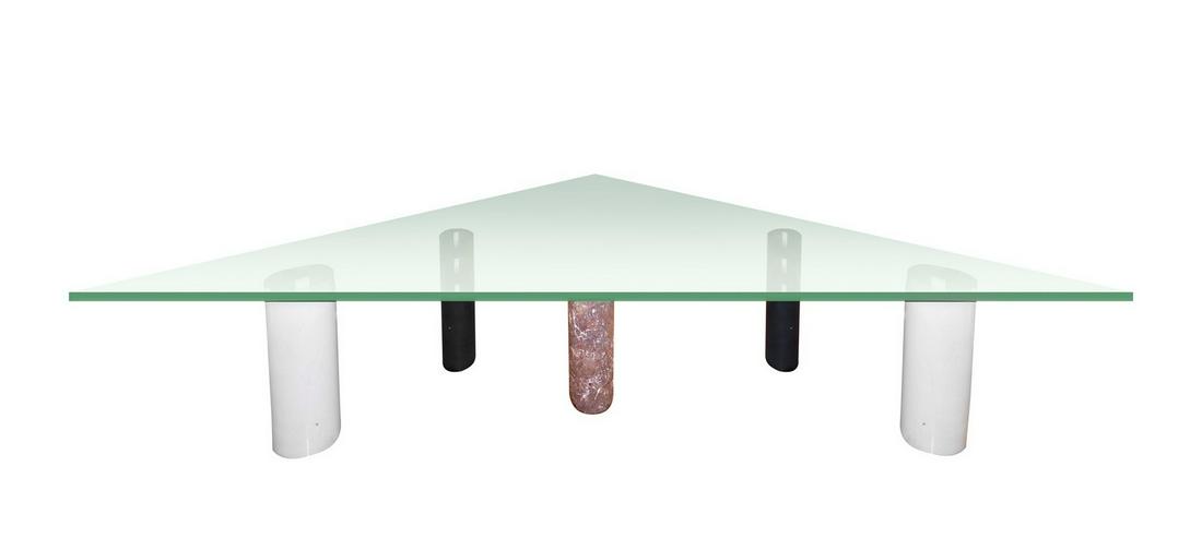 Low triangular table with support feet formed by cylindrical geometric elements in marble (1 of 2)