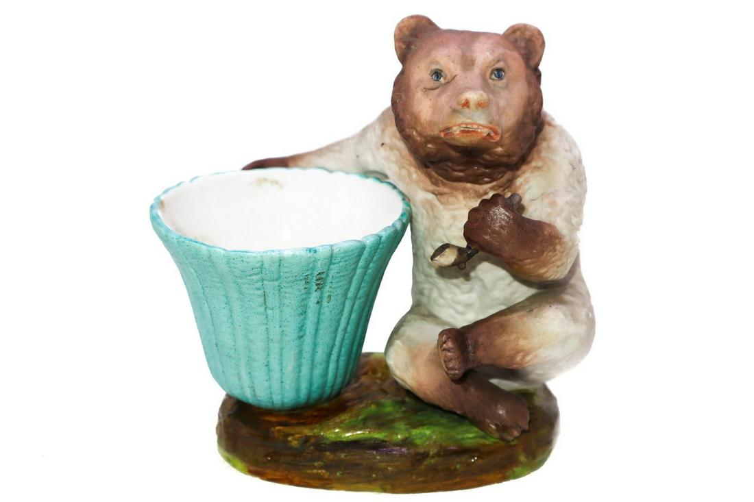 Bear with vase: h cm 17 x cm 16 In polychrome bisque.