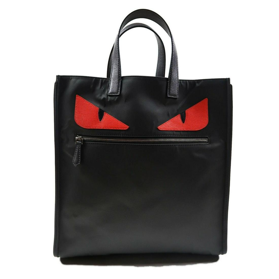 New Fendi AUTHENTICATED Large Monster Tote Bag Red Face: "New Fendi AUTHENTICATED Large Monster Tote Bag Red Face Black Nylon Details:- red leather eyes detail- dustbag included- item # SPIT19Condition: New with dustbagMeasurements:Height: 15” / 38 cmLeng