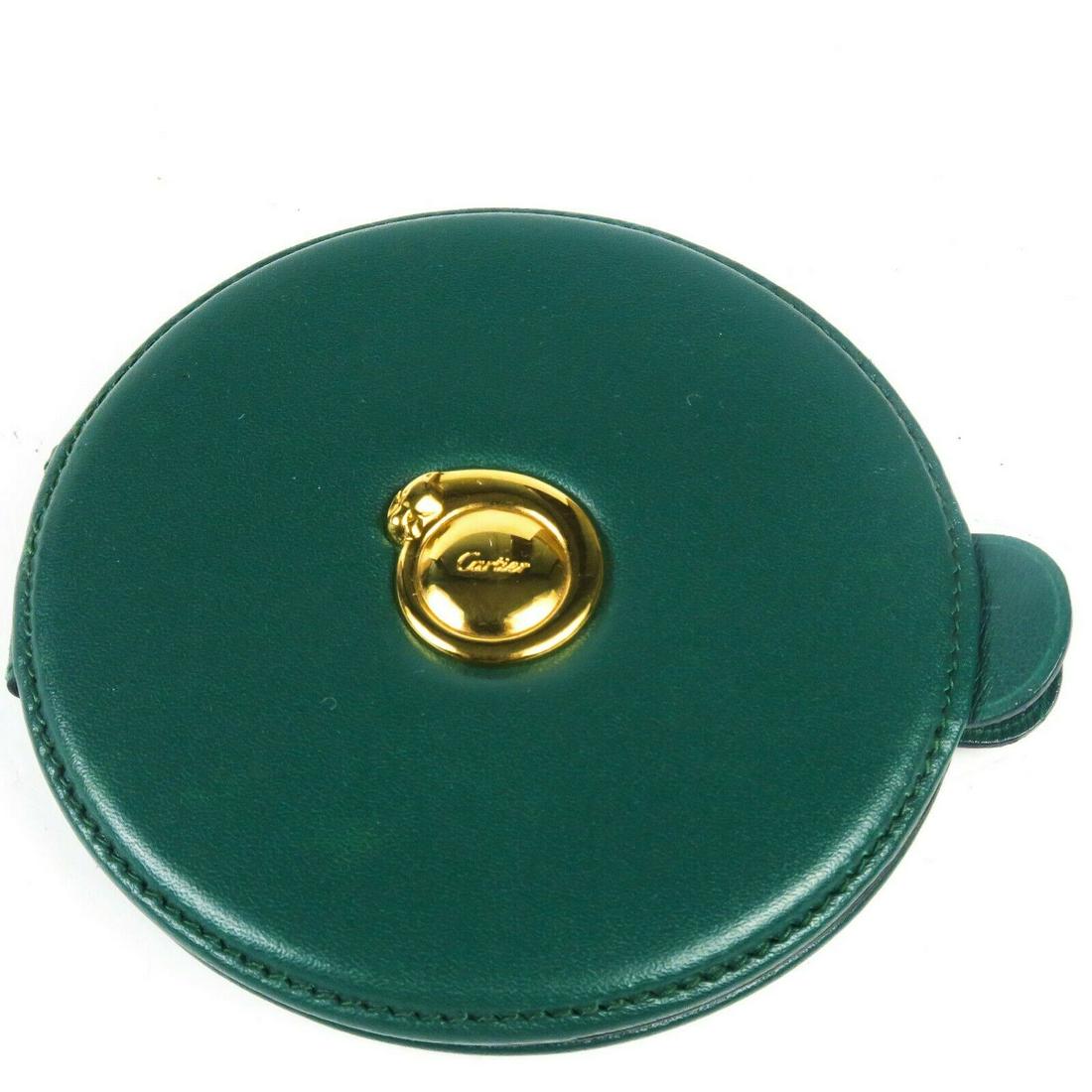 Cartier - Mirror - Green Leather Gold Make-up Hand: Cartier - Green Leather Make-up Mirror Color: Green Material: Leather ------------------------------------------------------------ Details: - gold-tone hardware - box and cloth included - item #AA2862