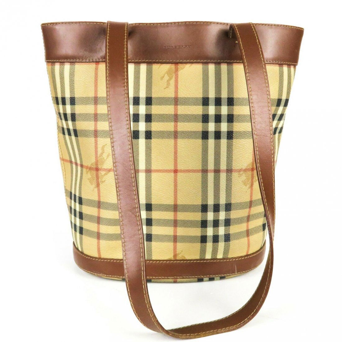 Burberry - Bucket Bag - Tan Plaid Brown Leather: Burberry - Bucket Bag - Tan Plaid Brown Leather Long Straps Color: Multi Material: Leather - Coated Canvas ------------------------------------------------------------ Details: - long leather straps -