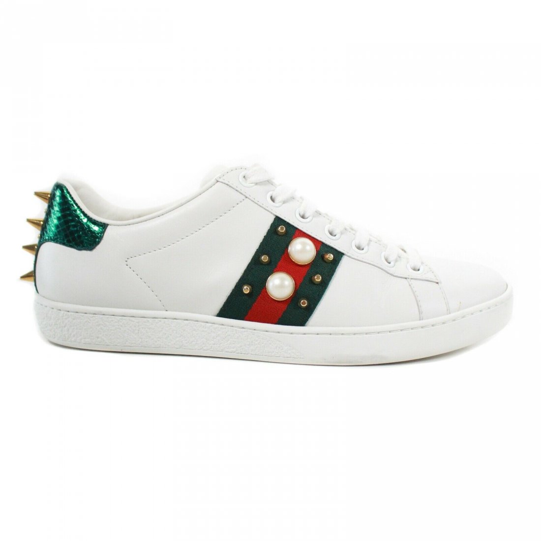 Gucci - Ace White Embellished Sneakers - Women's 7.5: Gucci - Ace White Embellished Sneakers - Web Stripe Size: Women's 37.5 - US 7.5 Color: White Material: Leather ------------------------------------------------------------ Details: - Embellished with