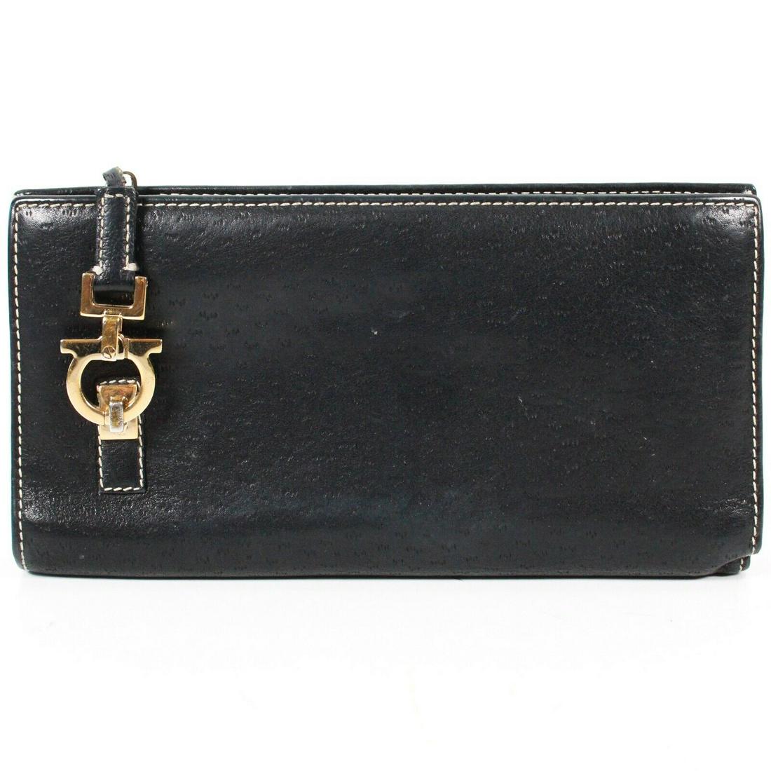 Salvatore Ferragamo - Black Long Wallet: Salvatore Ferragamo - Black Long Wallet Size: Long Color: Black Material: Leather ------------------------------------------------------------ Details: - Gold-tone hardware - item #ZFEL3 Measurements: