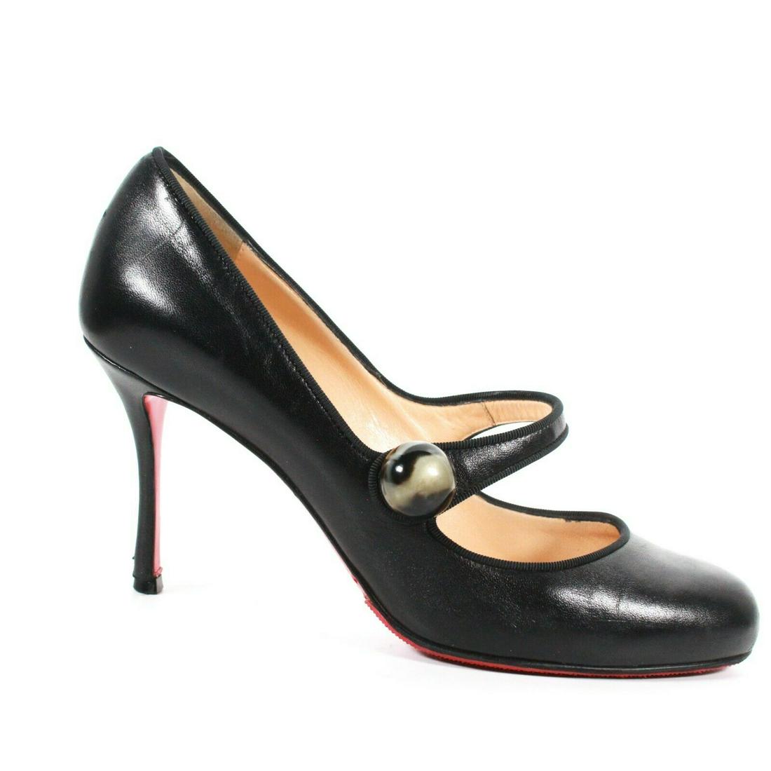 Christian Louboutin - Slip-on Mary Jane Heels Color:: Christian Louboutin - Slip-on Mary Jane Heels Color: Black Size: US 7.5 - EU 37.5 Materials: Leather ------------------------------------------------------------ Details: - large round marbled button 