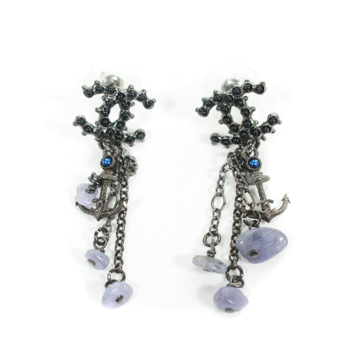 Chanel - 2018 - 18A CC Lite Violent Stone Anchor: Chanel - 2018 - 18A CC Lite Violent Stone Anchor Chandelier Dangle Earrings Color: Silver, Black, Grey, Blue Material: Metal, Rhinestone Crystals, Gems ------------------------------------------------