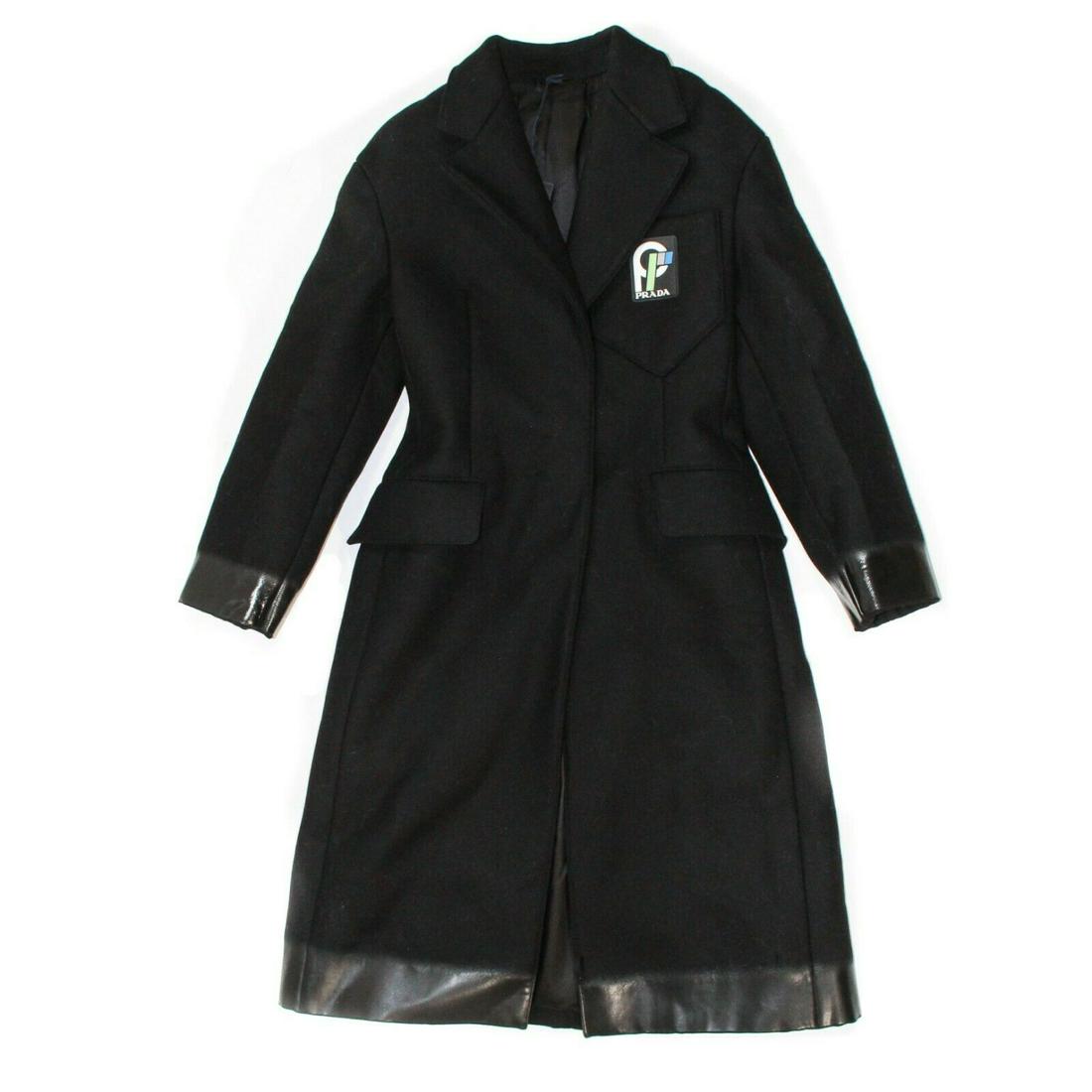 Prada - New 2018 Coat with Logo Patch & Bow: Prada - New - 2018 Coat with Logo Patch & Bow Color: Black Size: US 00 - 36 Materials: Virgin wool ------------------------------------------------------------ Details - rubber logo patch on front - b