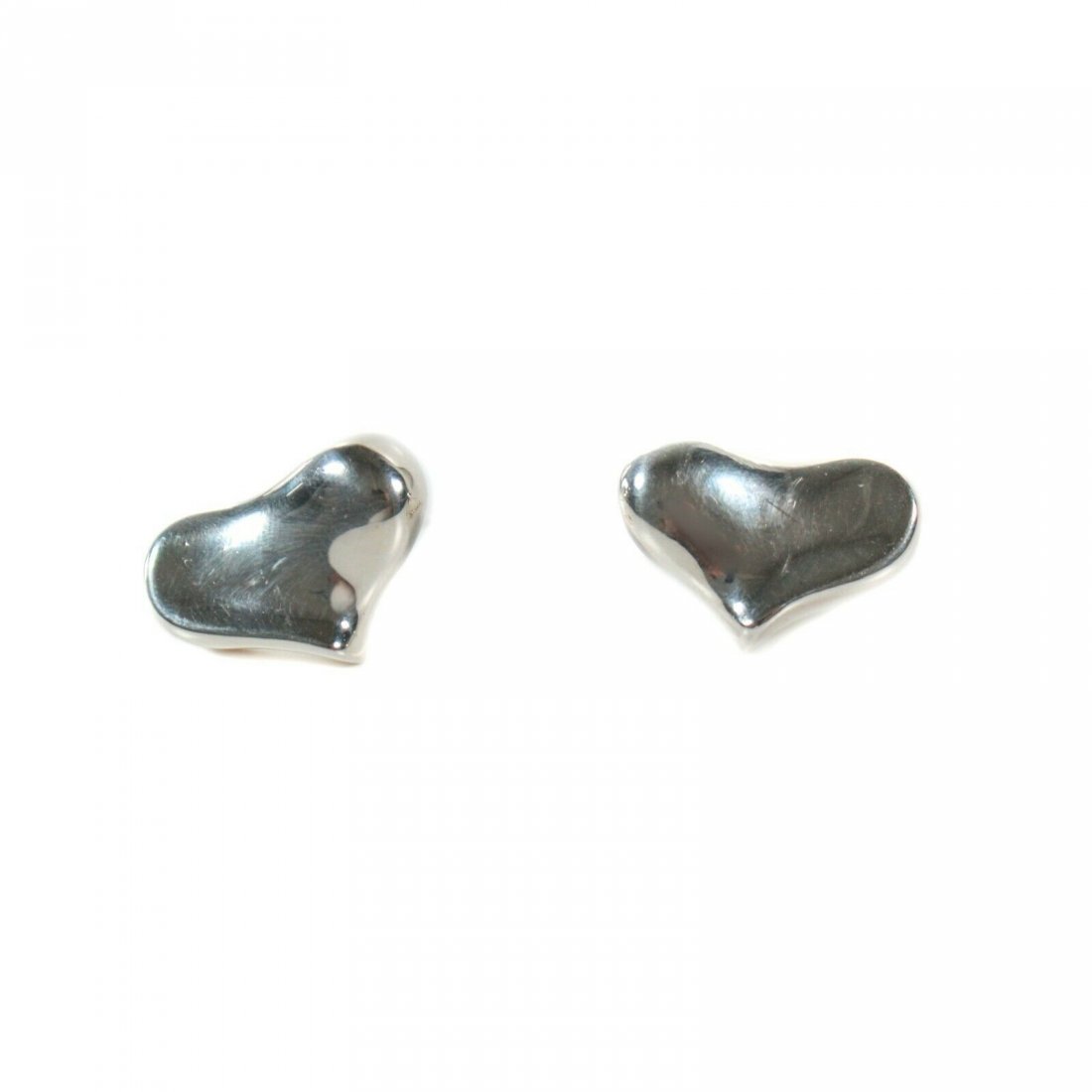 Angela Cummings - Sterling Silver Heart Stud Earrings: Angela Cummings - Full Heart Earrings Color: Silver Size: Large Material: Sterling silver ------------------------------------------------------------ Details: - omega back studs - item #LMAI20 Condit