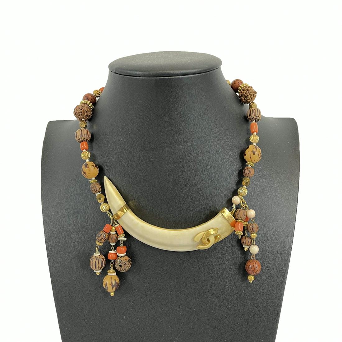 Chanel - Collection 29 - Rare Ivory Elephant Tusk Enamel CC Necklace Choker: Chanel - Collection 29 - Rare Ivory Elephant Tusk Enamel CC Necklace ChokerChanel - Excellent - Rare Ivory Elephant Tusk Enamel CC necklace Choker - Ivory, Brown, Red, Orange - Necklace Description * 