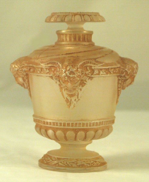 1925 R Lalique Guerlain Bouquet De Faunes w sepia: Gorgeous urn shaped flacon with pan and maiden figures. This is the more desirable first release as noted by the swirls on the top of the bottle. The newer version has no swirls. Clear and frosted gla