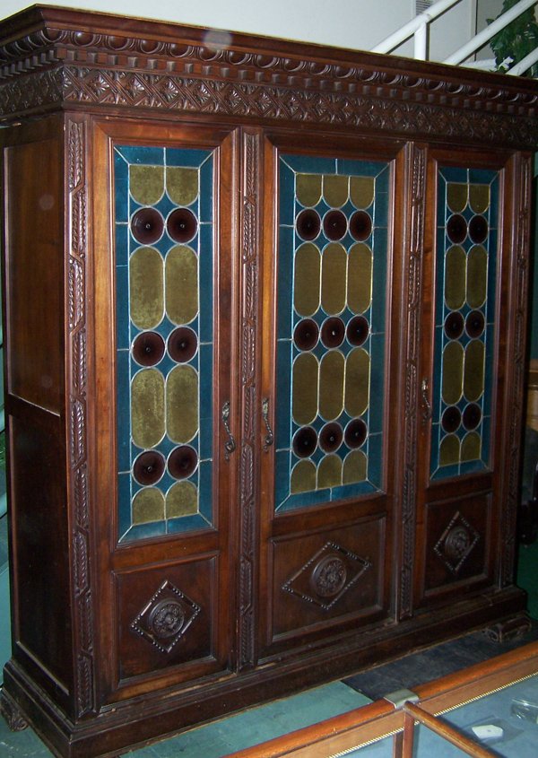 Fine Italian Walnut Leaded Glass Cabinet: A good 19th century walnut cabinet having leaded glass doors. One has age cracks in the leaded colored area. ALL Italian antiques have wood beetle OLD damage, this item is no different.