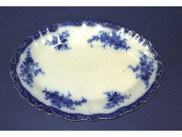 A Good Flow Blue Platter LOURAINE Pattern: A good 10" flow blue platter in good condition with minor usage wear to face of platter.