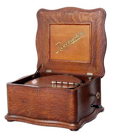 RARE REGINAPHONE Oak Player: This originally had the ability to play records in addition to the music discs but we don't have that part of the mechanism in this auction, we sold one complete with the other part for nearly 10 gran