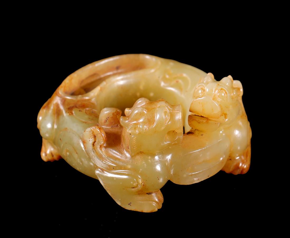 Yellow Jade Ornament with Two Beast Design from Han: Yellow Jade Ornament with Two Beast Design from Han Dynasty Dimensions: H: 1 1/4 in(3.3cm) W: 2 3/8 in(6cm) Weight: Wt:106g