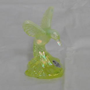 Fenton Iridized Vaseline Glass Hummingbird: Fenton Iridized Vaseline Glass Hummingbird. Original Label and Oval Fenton Mark. 4.25" tall in good condition.