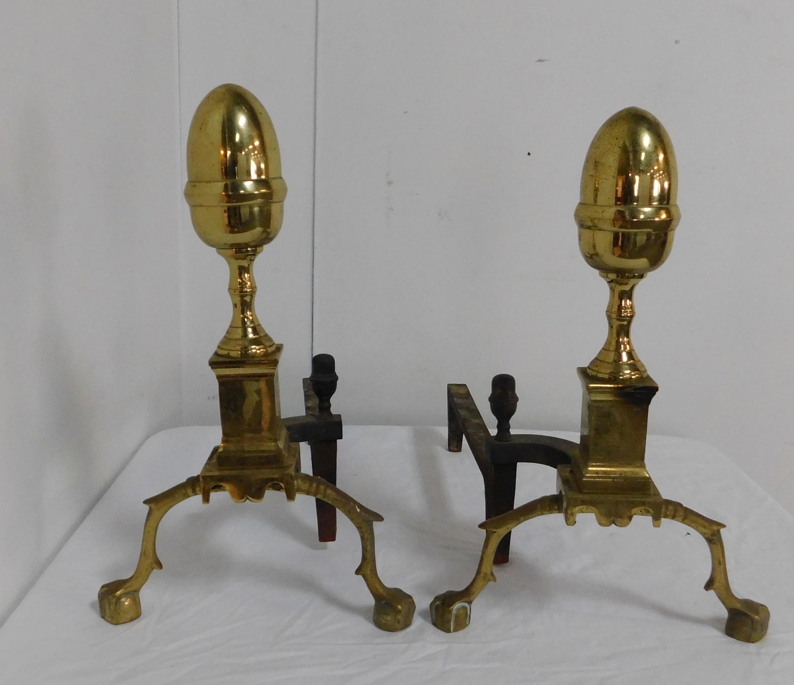 Virginia Metalcrafters Acorn Finial Brass Andirons: Virginia Metalcrafters Acorn Finial Brass Andirons in good condition, Ball and Claw Feet, Williamsburg Style, 19''H x 12''W x 8''D