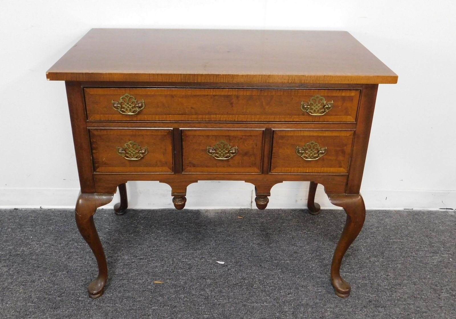 Queen Anne Hickory Furniture Inlaid Low Boy: A Hickory American Masterpiece Collection mahogany lowboy dresser. It features a top with an American eagle and shield inlay, a solid wood body, four drawers with dovetail joinery and brass tone handl