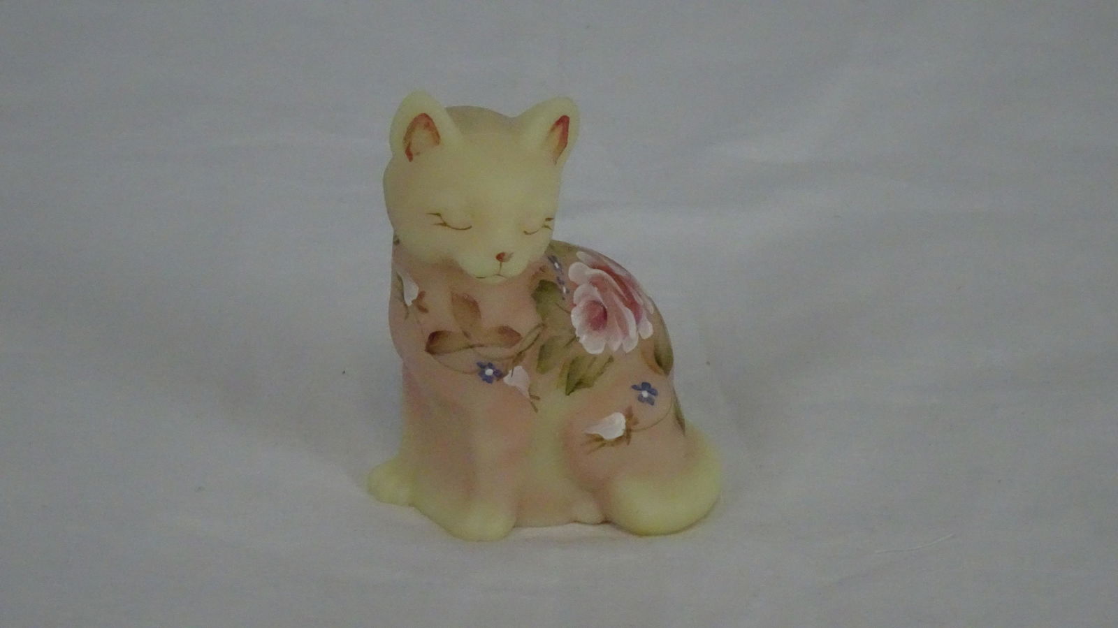 Signed Fenton Hand Painted Burmese Cat: Signed Fenton Hand Painted Burmese Cat. Artist Signed with Paper Label and Script F Mark. 3 7/8" H and 2 3/4" W in Good Condition.