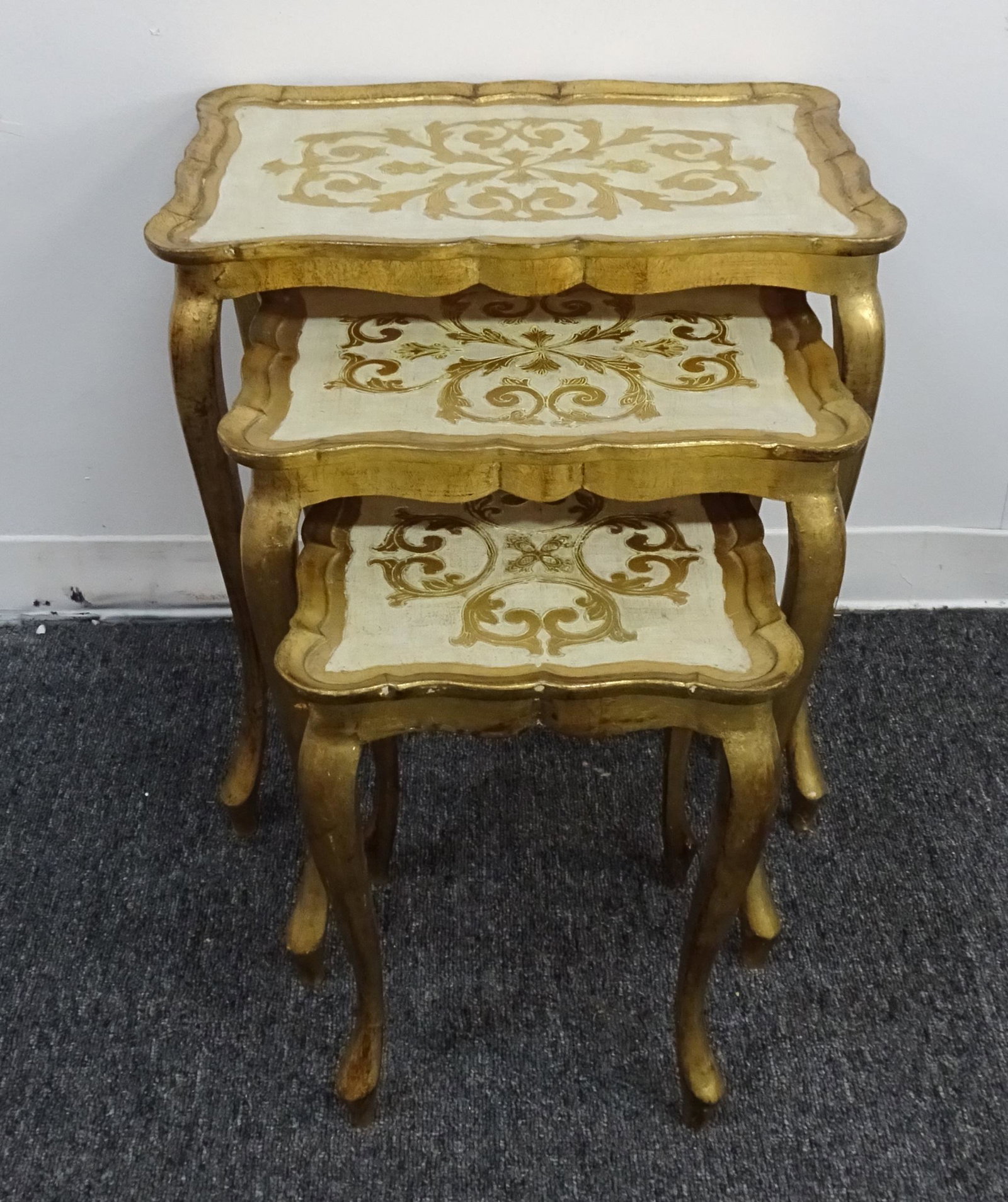 Italian Florentine Giltwood Nesting Tables: Italian Florentine Giltwood Nesting Tables. Hollywood Regency Style all Wood Tables in good condition. Large Table 22.5"H x 21.5"L x 14"W. Medium Table 20"H x 17"L x 12.5"W. Small Table 17"H x 12.5"L 