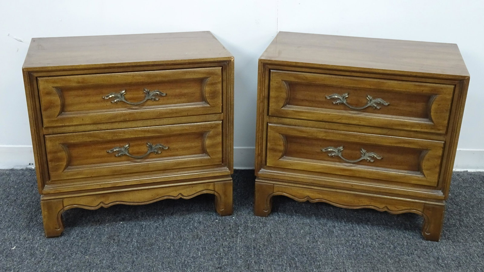 Pair of French Provincial Nightstands: Pair of French Provincial Nightstands in good condition, each with 2 drawers, brass hardware, 23''H x 25''W x 15.5''D