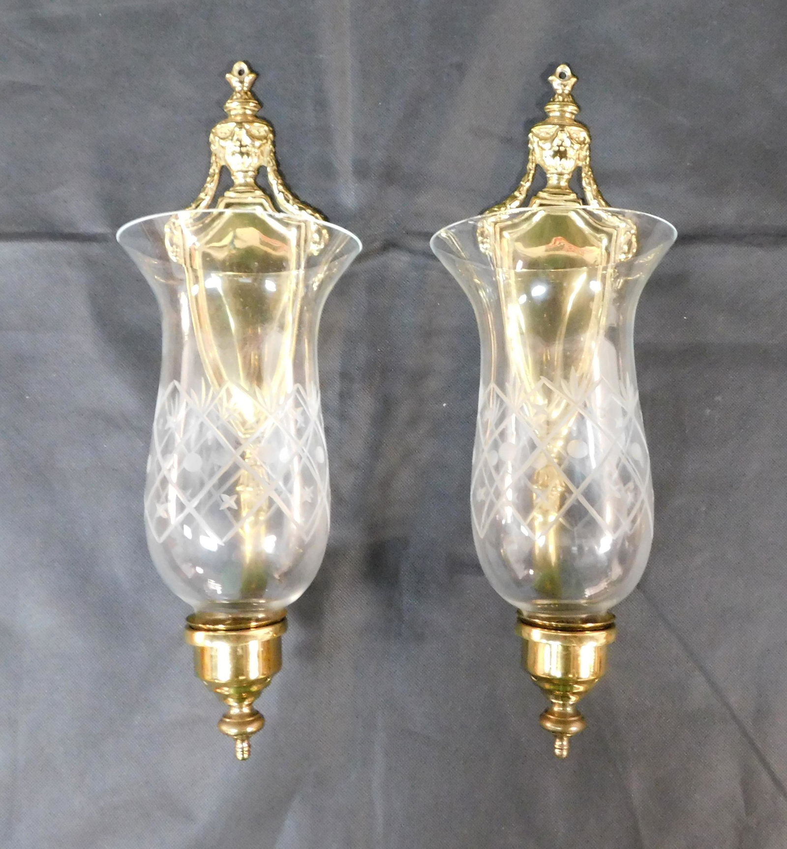 Pair of Virginia Metalcrafters Brass Wall Sconces: Pair of Virginia Metalcrafters Brass Wall Sconces in good condition, with etched glass globes, 2009, 16''H, one globe has small rim chip,