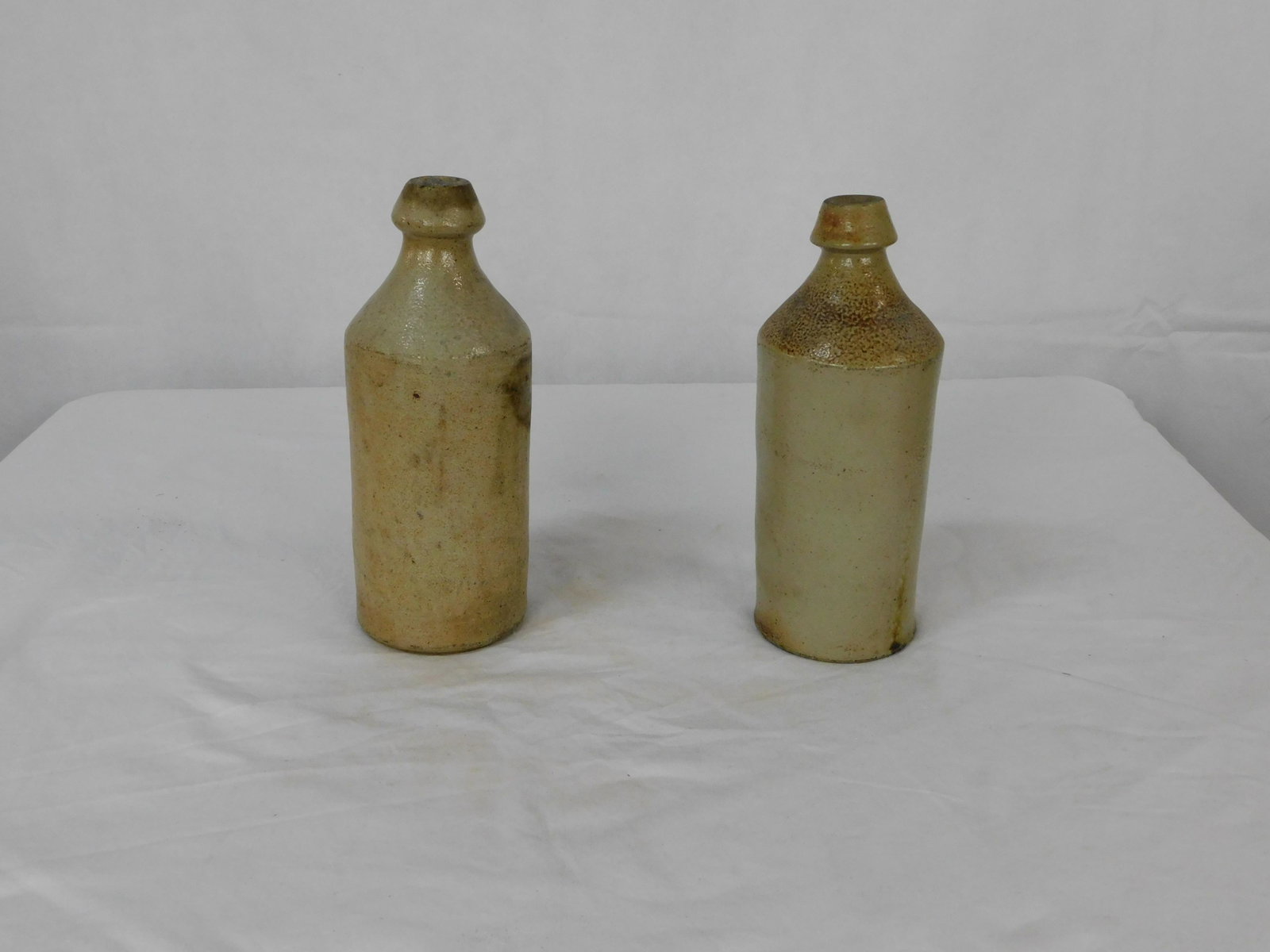 2 Early Stoneware Bottles: 2 Early Stoneware Bottles in good condition, 10''H