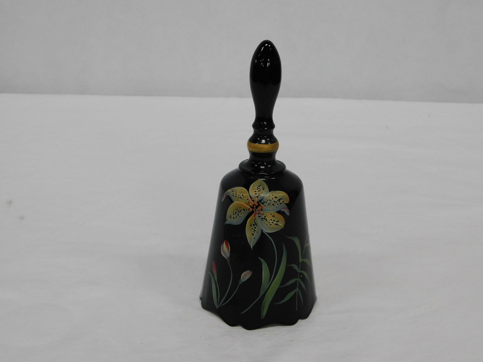 Fenton Signed HP Tiger Lily on Ebony Glass Bell: Fenton Signed Handpainted Tiger Lily on Ebony Glass Bell in good condition. Paper Label and Oval Mark signed D. Robinson. 6.5"H