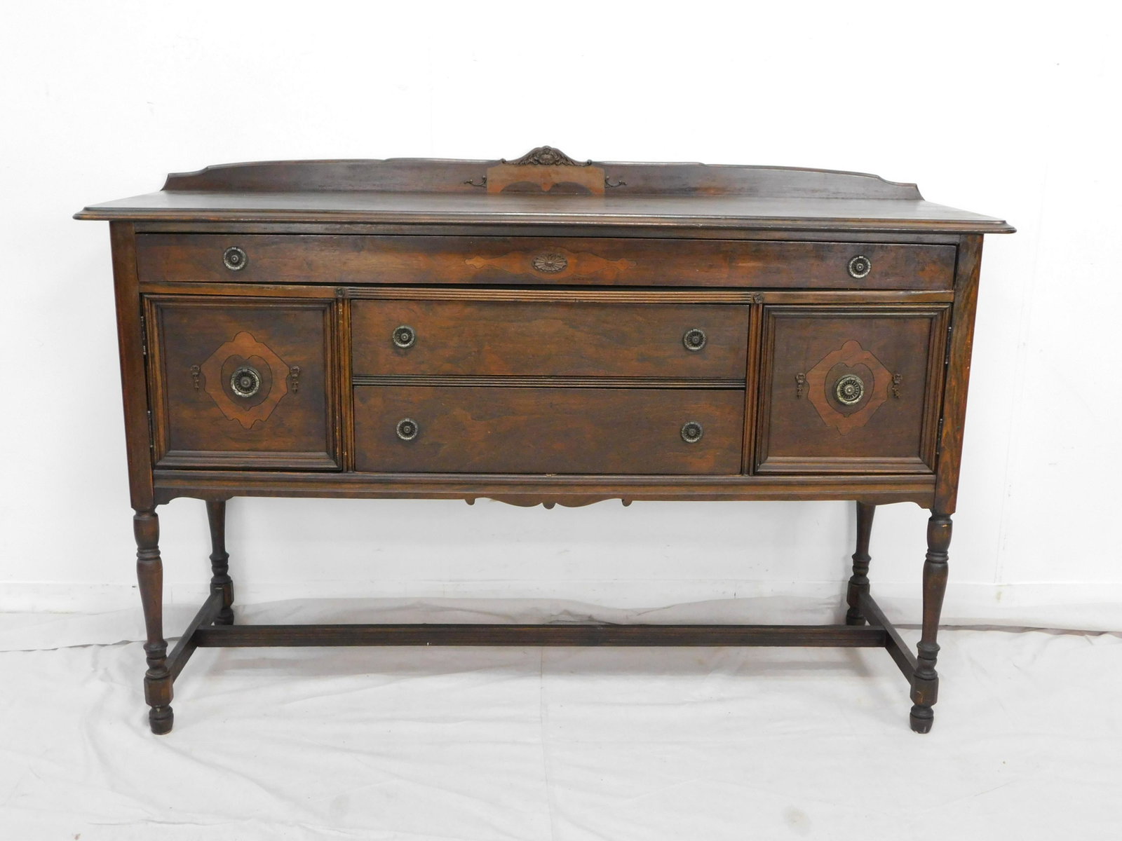 Antique Walnut Sideboard: Antique Walnut Sideboard in good condition, dovetailed drawers, stretcher base, One long drawer over two doors and two smaller drawers, with Backsplash, 40.5''H x 60''W x 20''D