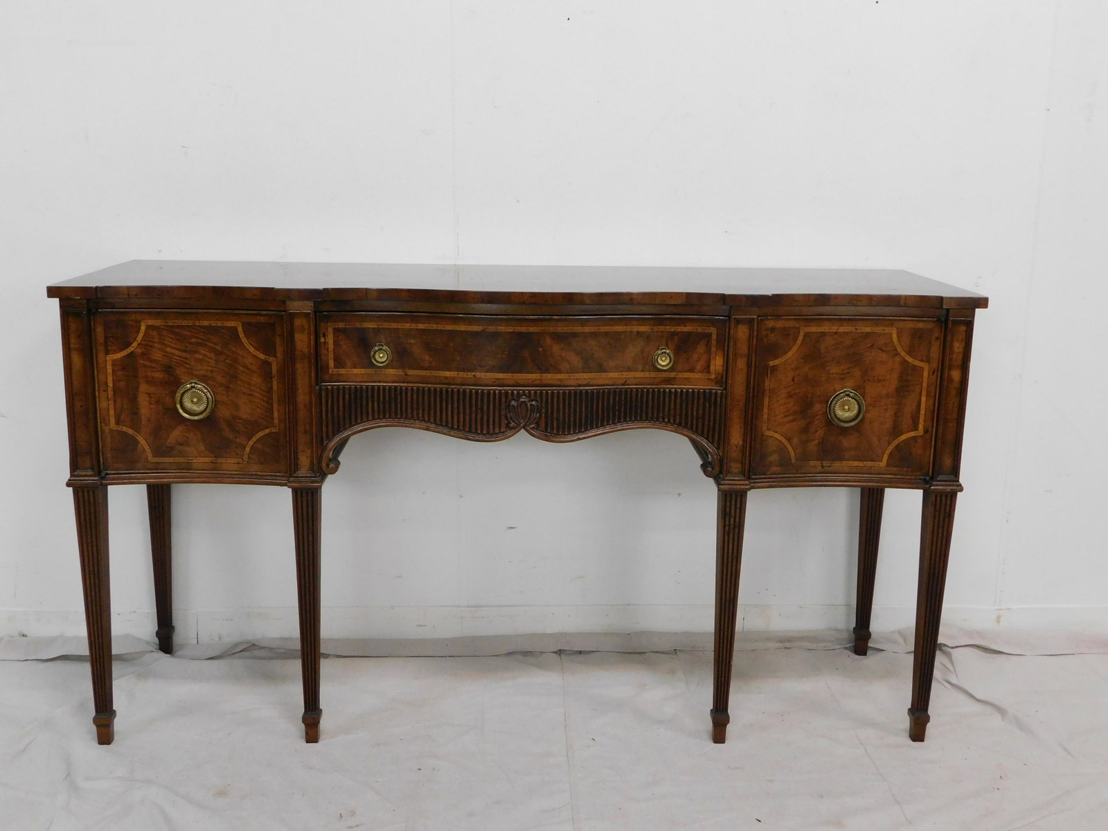Hepplewhite Banded Sideboard by Heritage: Hepplewhite Banded Sideboard by Heritage in very good condition, brass hardware, Six Leg, Serpentine Front, 34''H x 64''W x 19''D