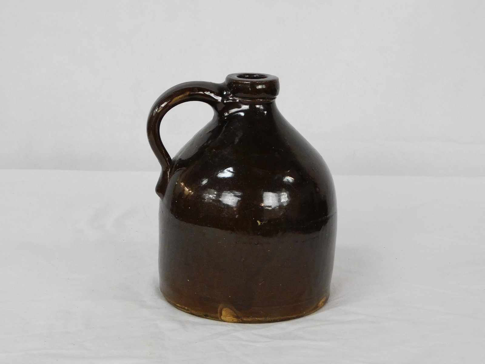 Brown Crock Jug: Brown Crock Jug in good condition, small chip on handle and lip of jug, 8.5''H
