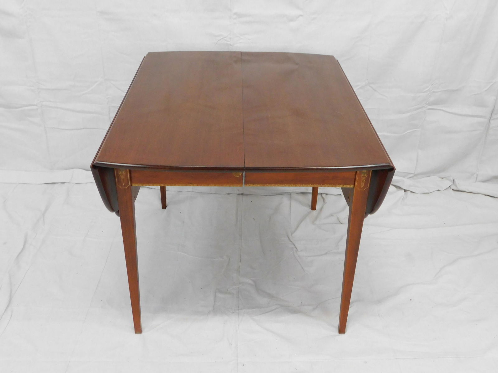 Hitchcock Cloverleaf Dining Table with Two Leaves: Hitchcock Cloverleaf Dining Table with Two Leaves in very good condition, Stenciled Skirt and Stenciled Table Top, Drop Leaf Style Table, Stenciled Hitchcock Signature on base of Table, 29.75''H x 42'