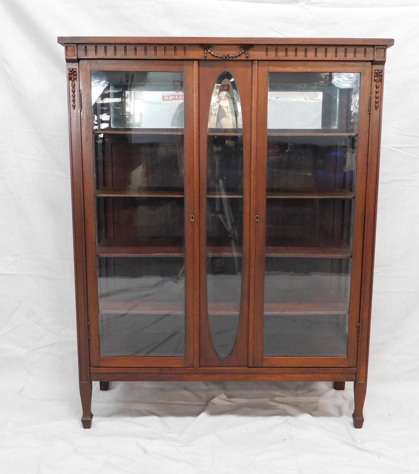 Antique Sheraton Mahogany China Cabinet: Antique Sheraton Mahogany China Cabinet in good condition, Beveled Middle Glass, Mirrored Back, has key, 60''H x 47''W 17''D