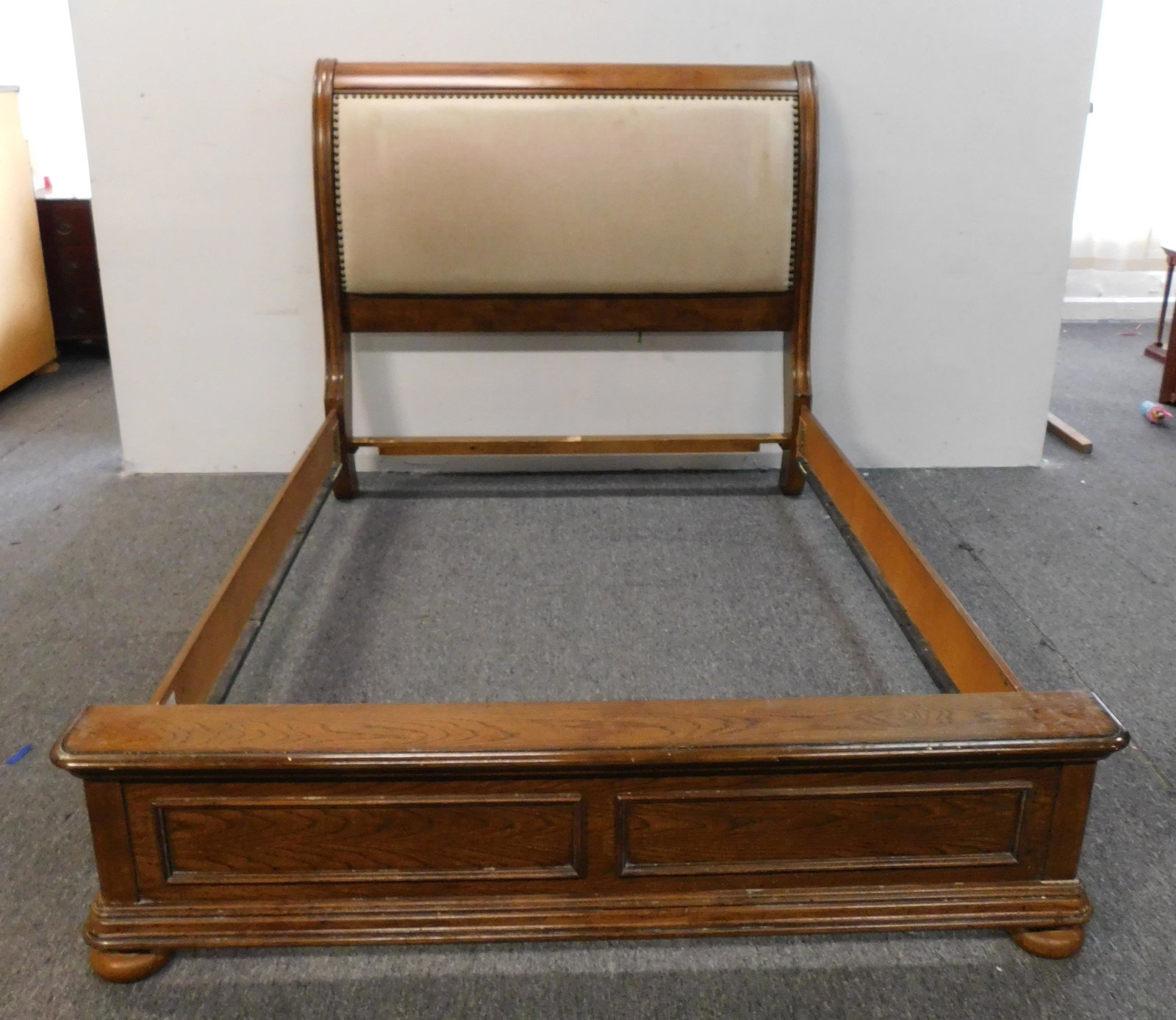 Modern Queen Size Sleigh Bed: Modern Queen Size Sleigh Bed in good condition, Upholstered back, ***Auctioneer Note: This is part of a bedroom suite, if interested in matching pieces, please bid on corresponding lots including the 