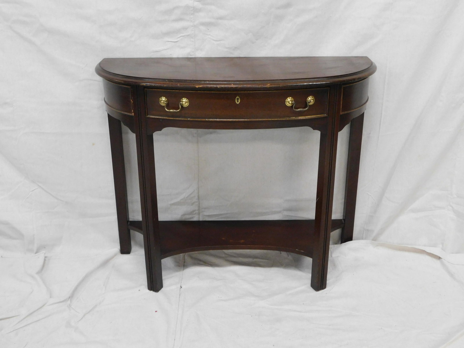 Mahogany Demilune Console Table: Mahogany Demilune Console Table in good condition, dovetailed drawer, brass hardware, 29''H x 36''W x 14.25''D