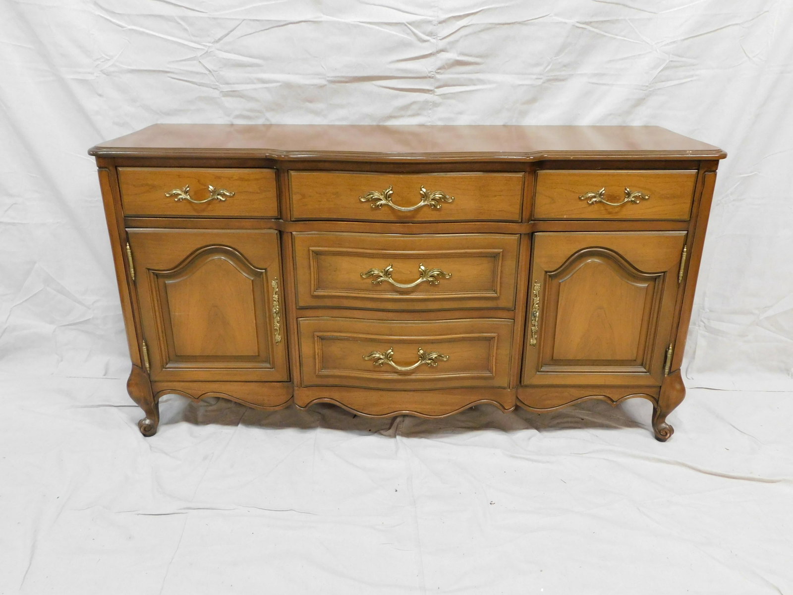 French Provincial Sideboard: French Provincial Sideboard in good condition, Silverware Drawer, Dovetailed Drawers, Brass Hardware, 33.25''H x 62''W x 20''D