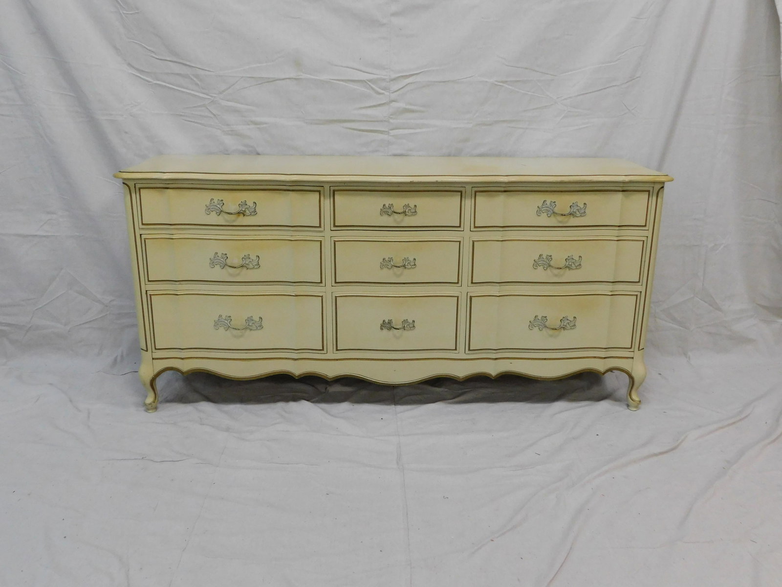 French Provincial Dresser: French Provincial Dresser in good condition, dovetailed drawers, 33''H x 72''W x 21''D ***Auctioneer Note: This is part of a bedroom suite, if interested in chest and nightstand please bid on correspo