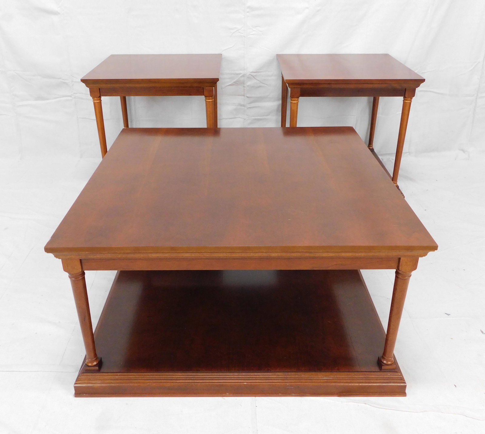 Cherry Set of Bombay Coffee and End Tables: Cherry Set of Bombay Coffee and End Tables in good condition, Coffee Table Measures 18.5''H x 36''W x 36''L, End Tables Measure 24''H x 24''W x 24''L