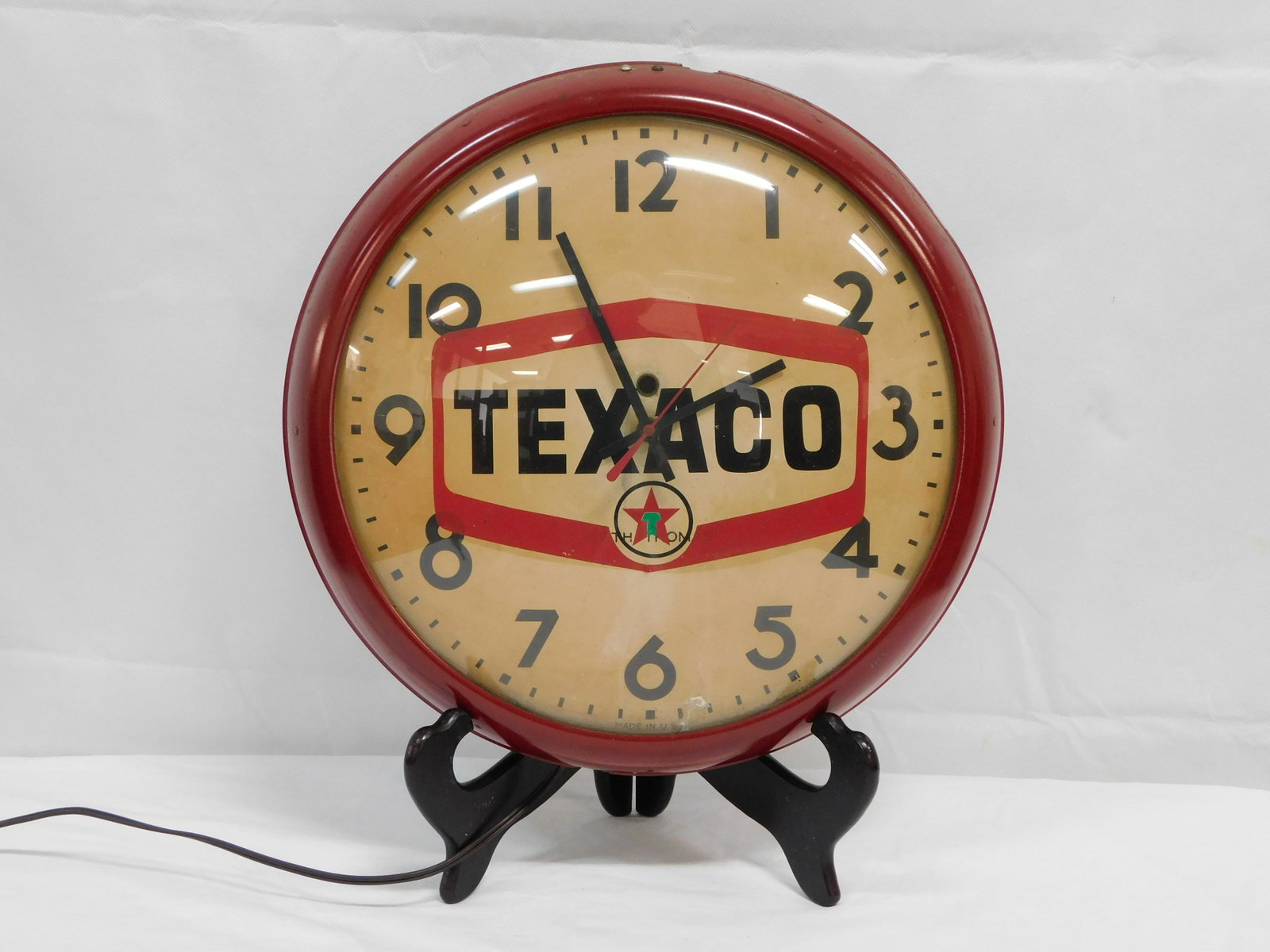 Antique Texaco Wall Clock: Antique Texaco Wall Clock in good condition. The works have been replaced with a working electric quartz movement. The clock is in good condition with original glass.15"D
