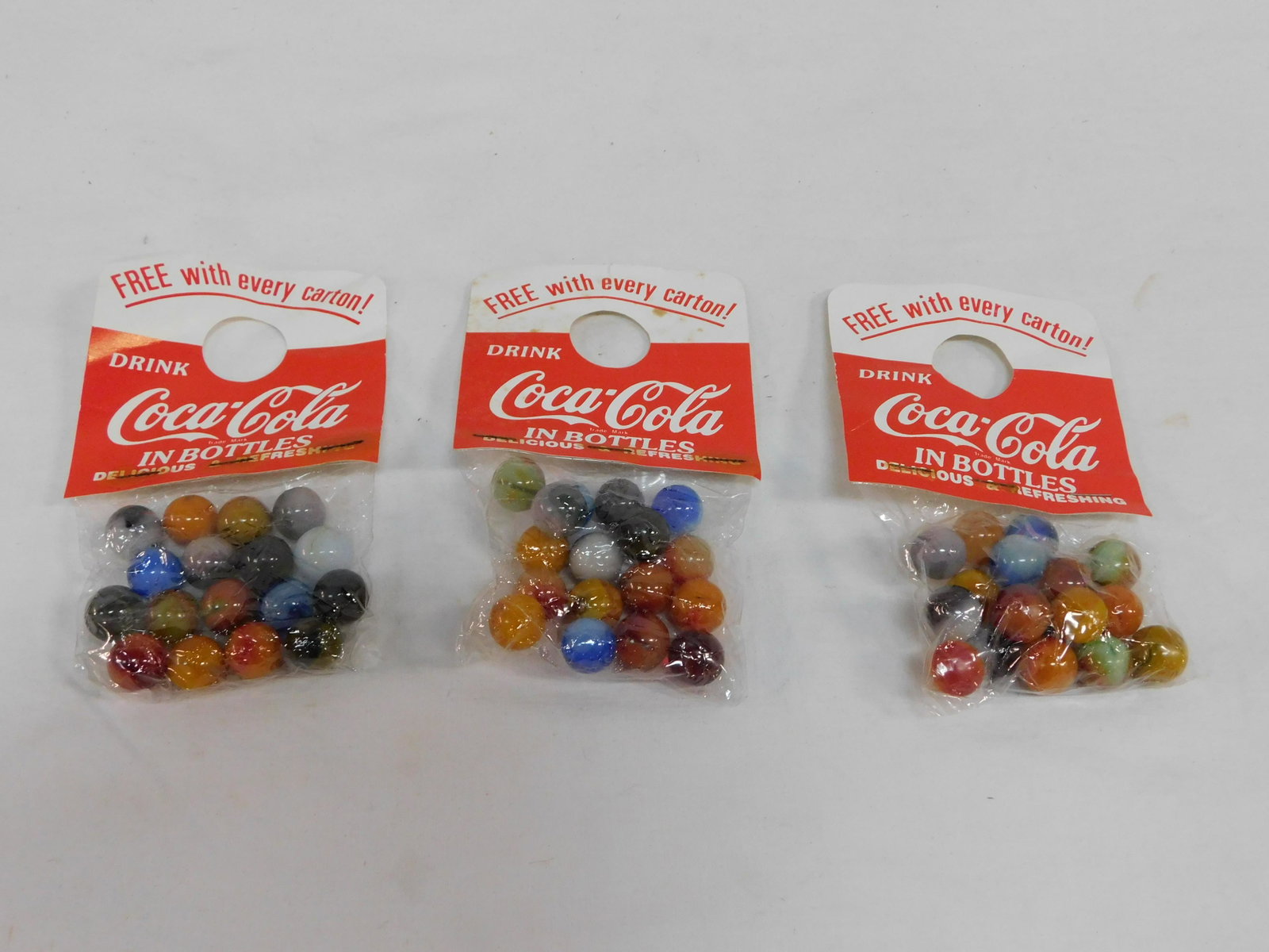 3 Vintage1960s Bags Coca Cola Promo Marbles: 3 Vintage1960s Bags Coca Cola Promo Marbles unopened in good condition.