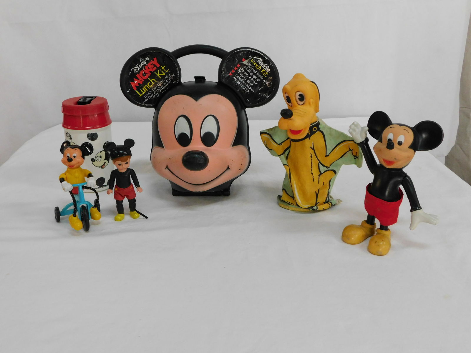 Vintage Assorted Mickey Mouse Lot: Vintage Assorted Mickey Mouse Lot in good condition, includes Pluto puppet, Mickey Mouse Lunchbox with Thermos, and 3 Figurines,