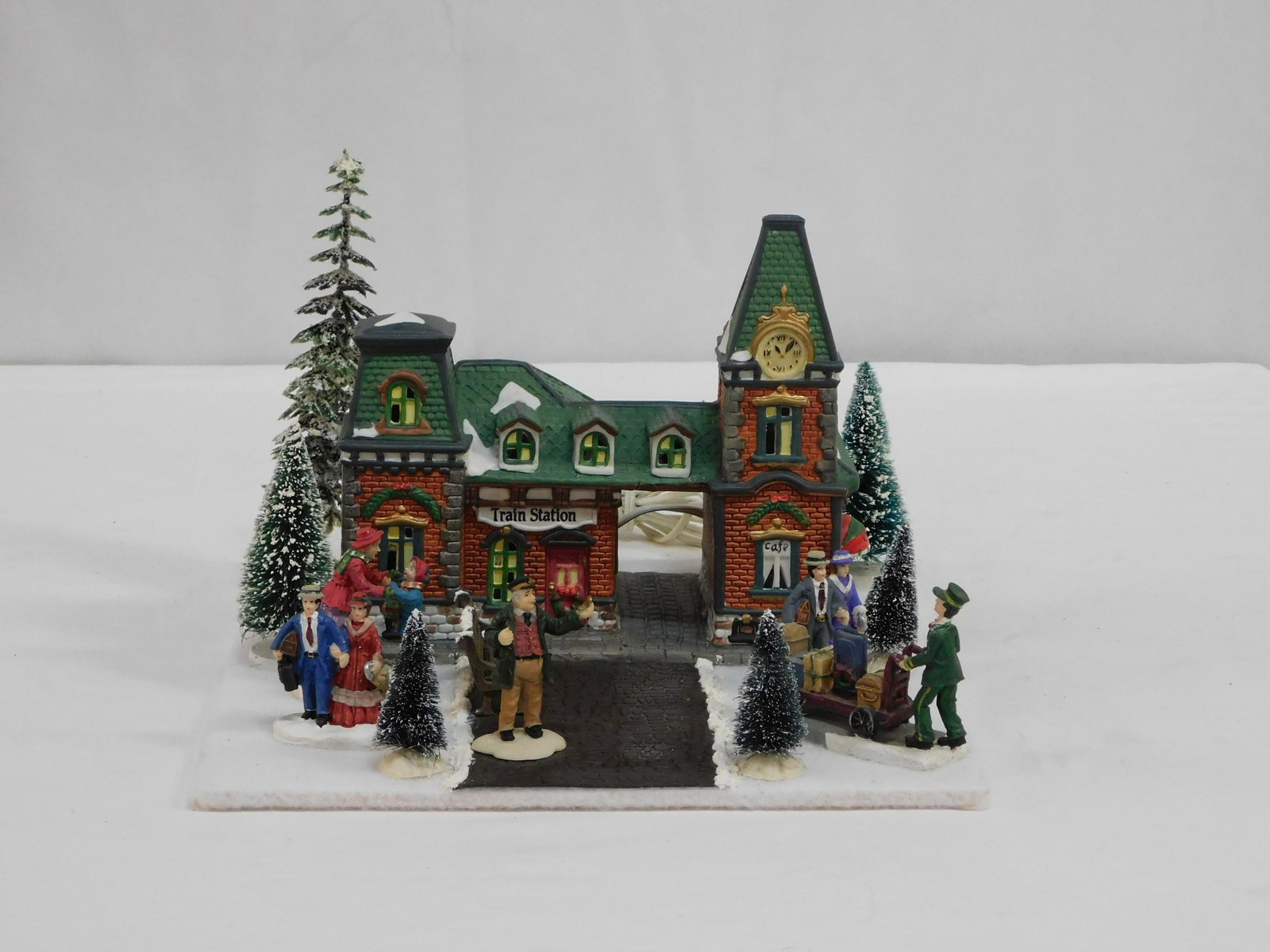 Dept 56 Train Station and Accessories: Dept 56 Train Station and Accessories mounted on 11.5" x 11.5" white felt wooden board with lights in good condition.