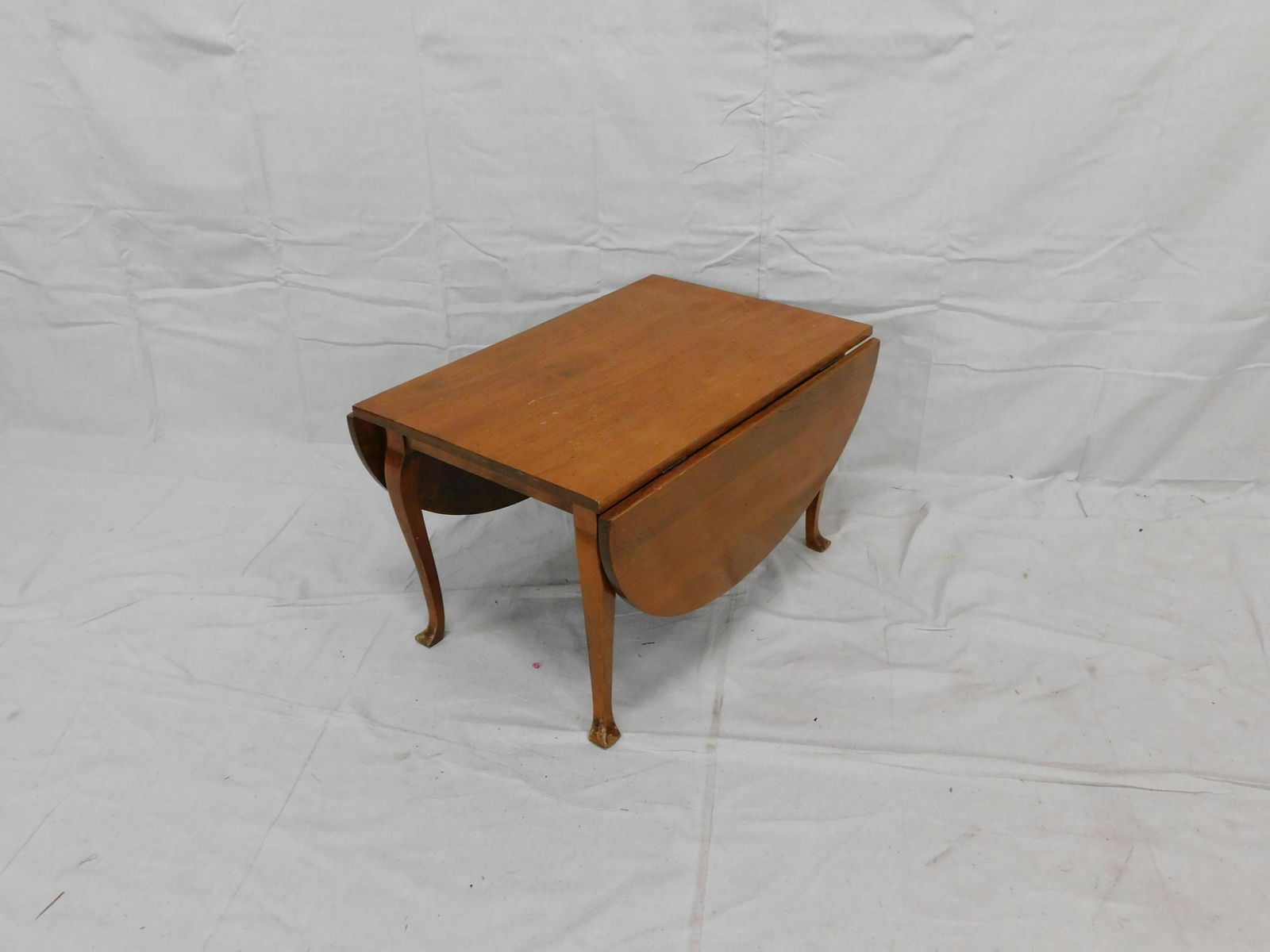 Antique Walnut Drop Leaf Cocktail Table: Antique Walnut Drop Leaf Cocktail Table in good condition, Tri Foot, 17''H x 19''W x 28''D with Two 11'' Leaves