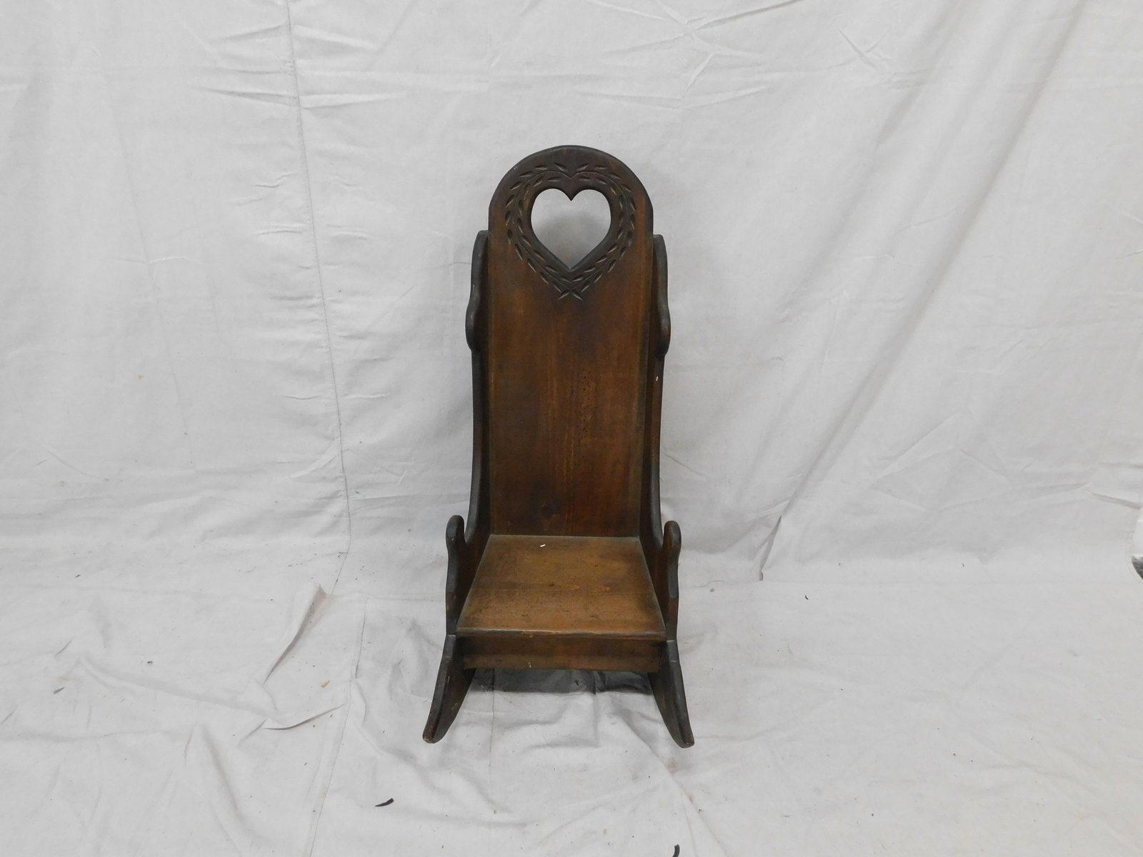 Carved Pine Childs Rocking Chair: Carved Pine Childs Rocking Chair in good condition, 34''H x 15.5''W x 26.5''D