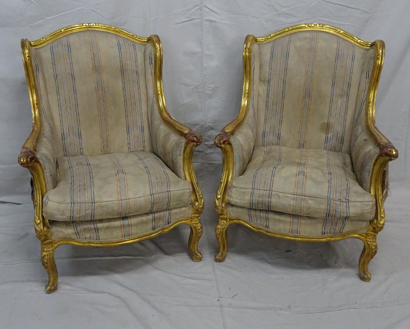 Pair of French Gilt Bergere's: Pair of French Gilt Bergere's, frames in good condition, needs new upholstery, has tears in current upholstery, 43''H x 31''W x 33''D