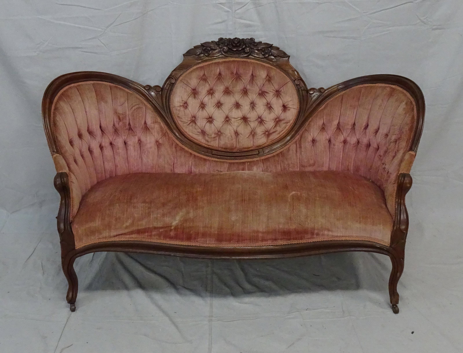 Antique Victorian Rose Carved Cameo Back Settee: Antique Victorian Rose Carved Cameo Back Settee, frame in good condition, upholstery could use cleaning and springs adjusted in seat, 37''H x 62''W x 34''D