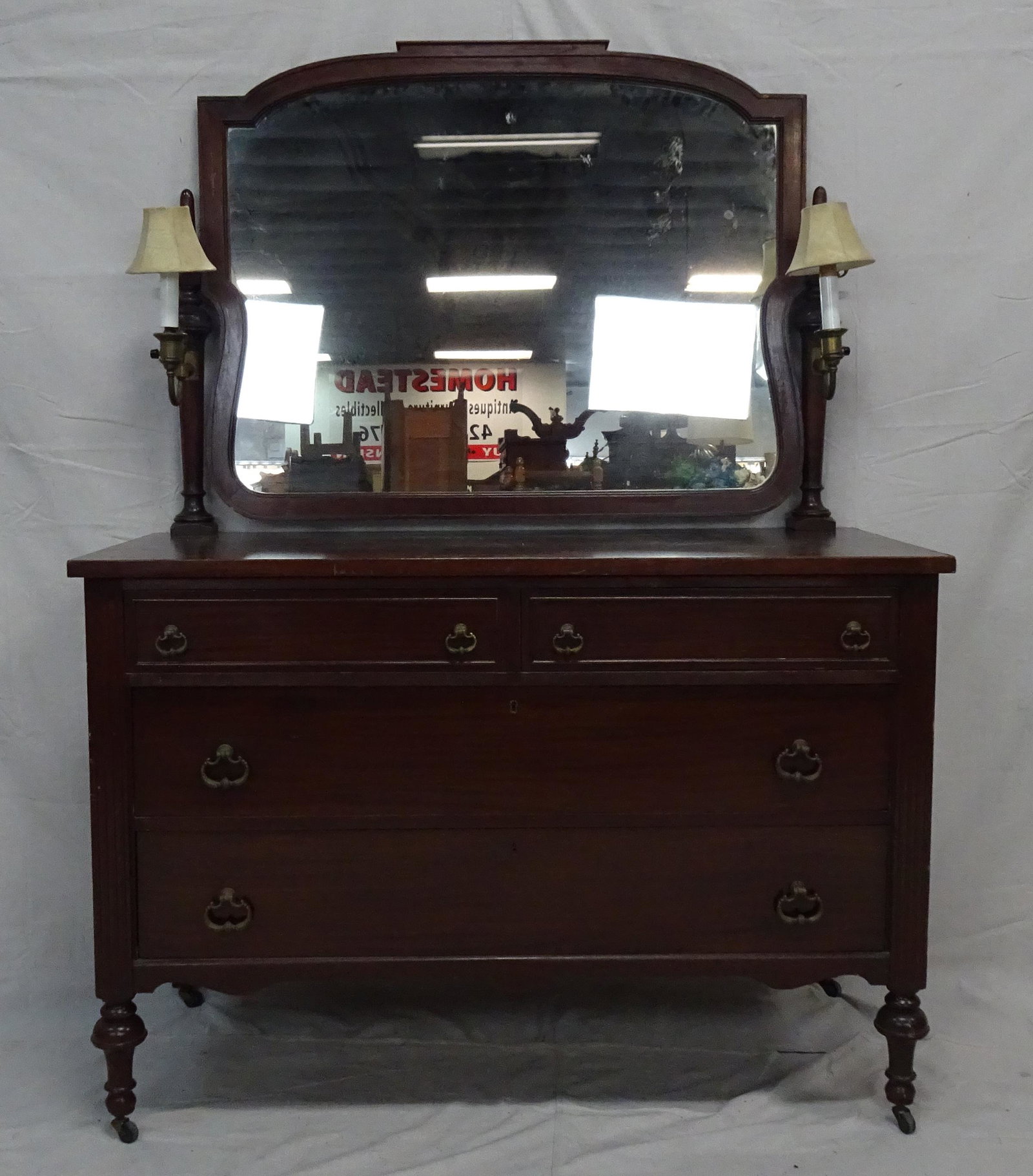 Antique Mahogany Dresser with Mirror: Antique Mahogany Dresser with Mirror with built in lamps, in good condition, Swivel Mirror, dovetailed drawers, 71''H x 52.25''W x 24''D
