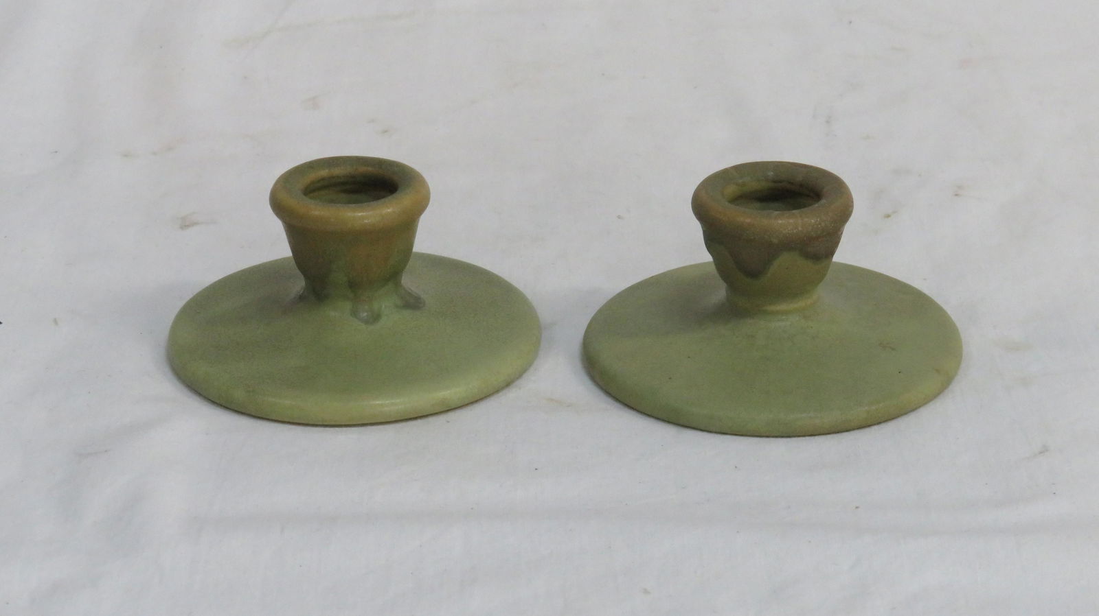 Pair Roseville Pottery Carnelian I Candle Holders: Pair Roseville Pottery Carnelian I Candle Holders in good condition with some light crazing. Shape 1058-2 with blue ink stamp on the bottom. 2"H