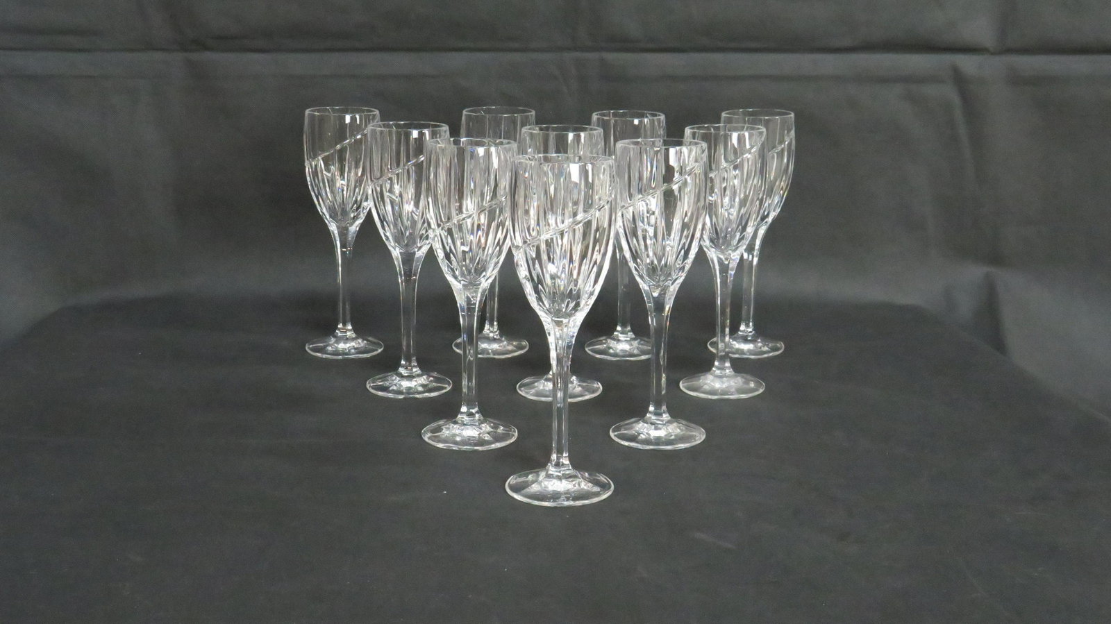 10 Mikasa Uptown Fine Crystal Wine Glasses: Set of 10 Mikasa Uptown Crystal Wine Glasses in good condition. Vertical and swirl cut with a textured foot. 8 1/8"H