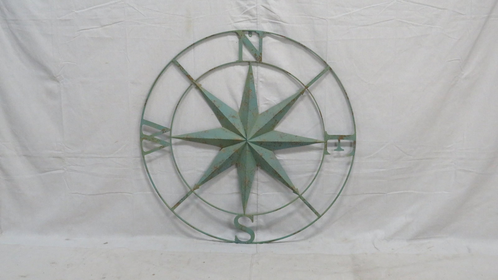 42" Metal Compass Sign: 42" Metal Compass Sign in good weathered condition.42"D