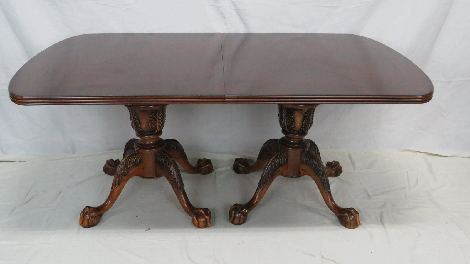Contemporary Traditional Chippendale Dining Table: Contemporary Traditional Chippendale Dining Table with Two Leaves, Double Pedestal Ball and Claw Base, Banded Top, Some Scuffs/Scratches to feet, otherwise good condition, 30.25''H x 72''L x 44''D wit