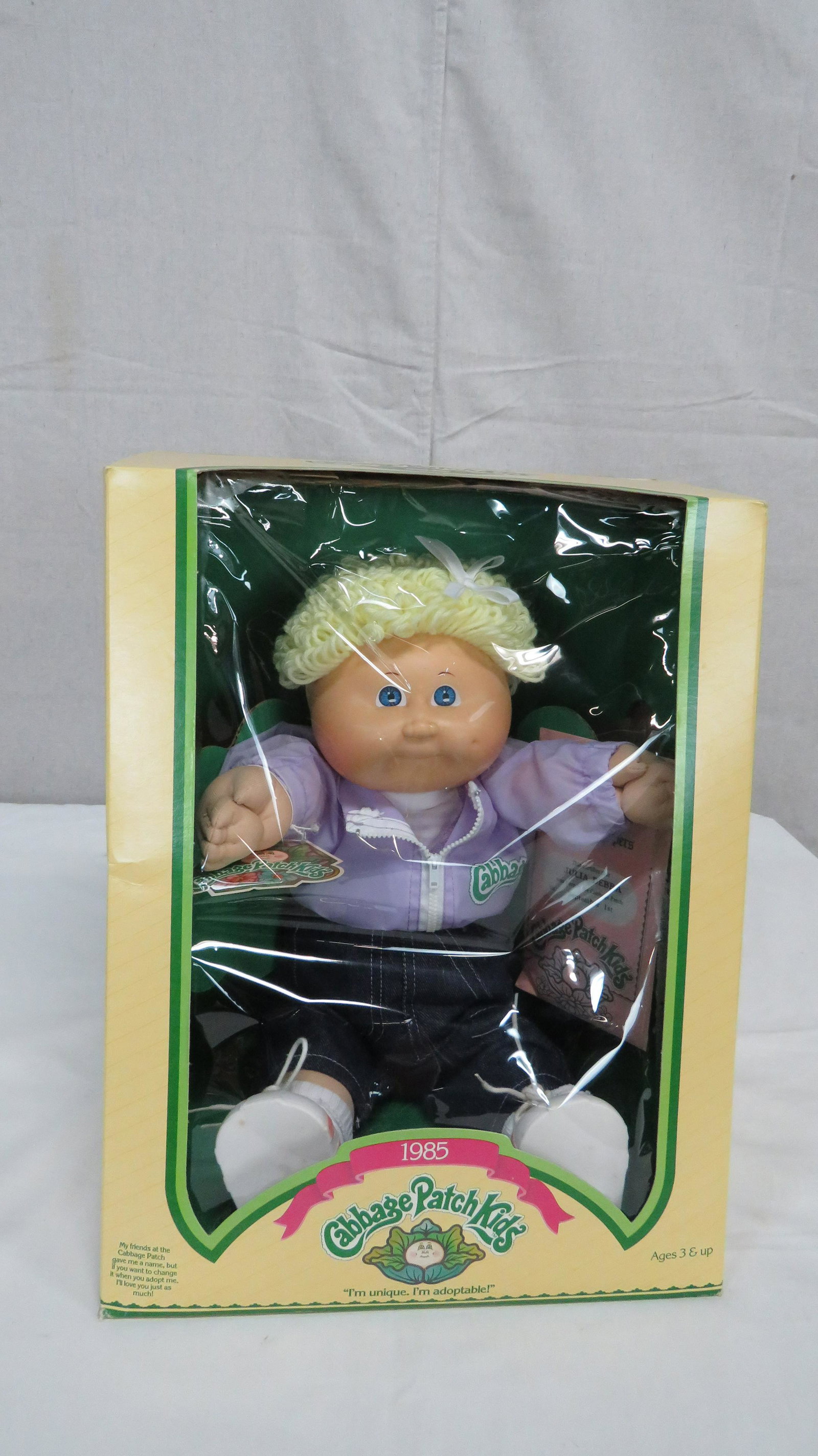 1985 Cabbage Patch Kids Doll Julia Debra: 1985 Cabbage Patch Kids Doll Julia Debra in original box. Box shows some shelf wear. Adoption papers and hang tag included. Box measures 14" x 11.5" x 9.5"
